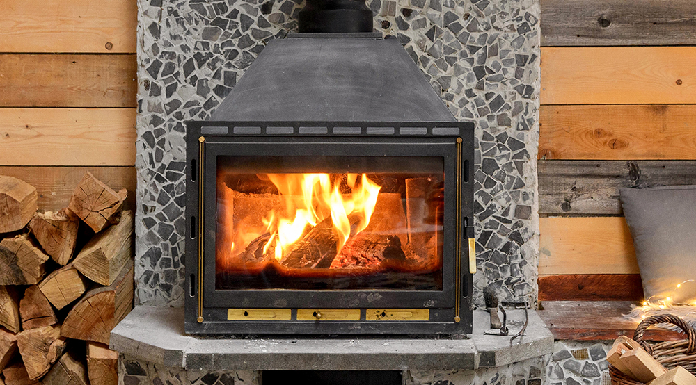 Wood burning stove with blackened glass